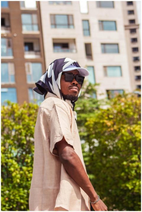 Cool vibes of a man in sunglasses in a sunny urban