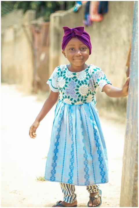 Smiling Child Blue Dress