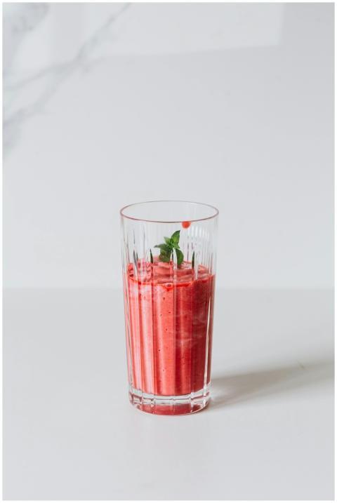 A refreshing strawberry smoothie in a glass with a