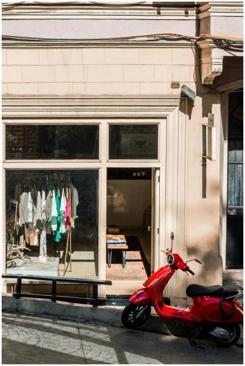 Bright storefront with vibrant clothing display an