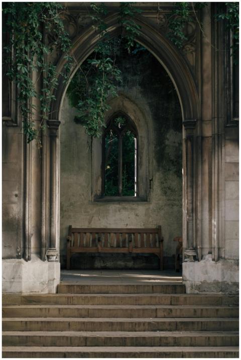 Serene view of an old Gothic archway with a wooden