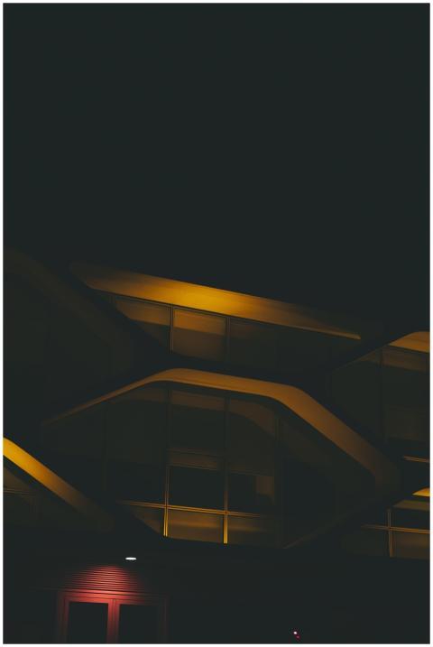 Night view of a modern building facade with striki