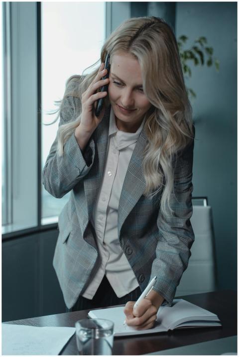 Professional businesswoman multitasking with phone
