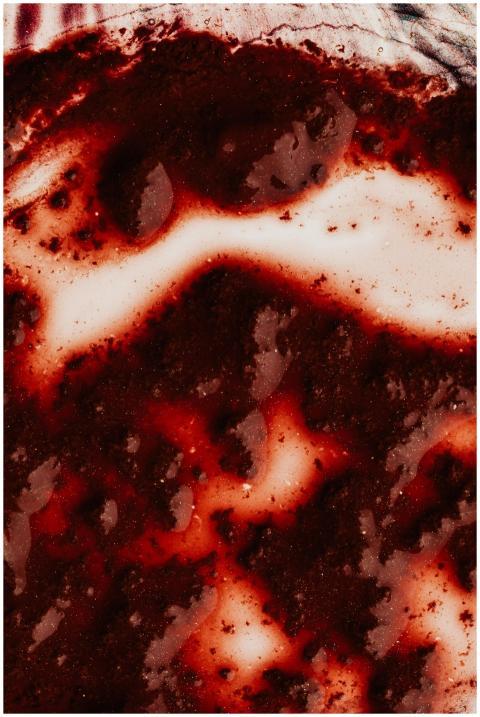 Top view closeup of bright splash and small partic