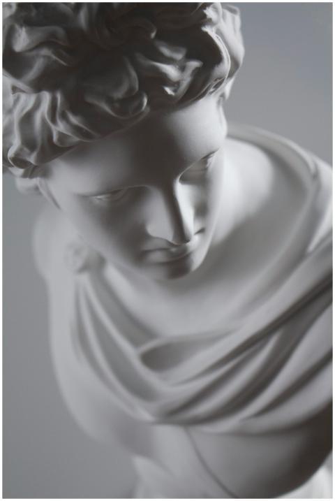 Close-up of a marble Apollo statue showcasing clas