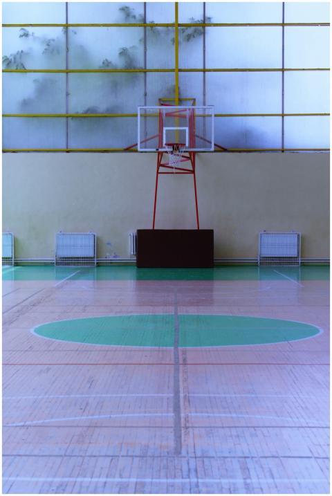 Modern basketball court indoors with glass walls a
