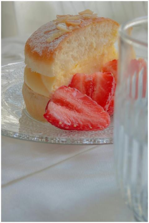 Scrumptious slice of cream cake with fresh strawbe