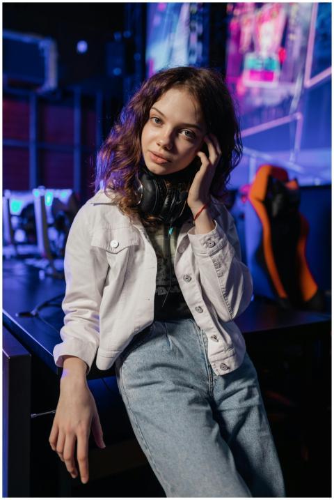 Portrait of a young woman in a gaming environment,