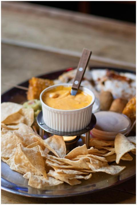 Close-up of tasty Mexican nachos served with a war