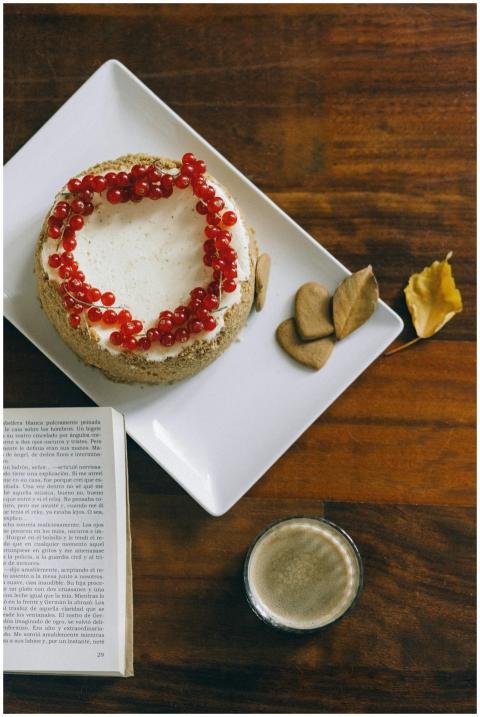 Delicious cake topped with lingonberries beside an