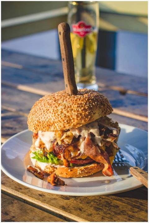 Delicious gourmet burger packed with bacon, cheese