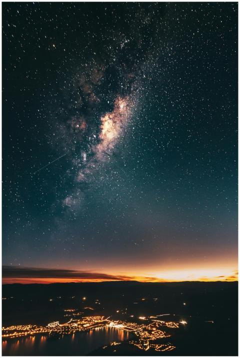 A stunning view of the Milky Way galaxy over a lit