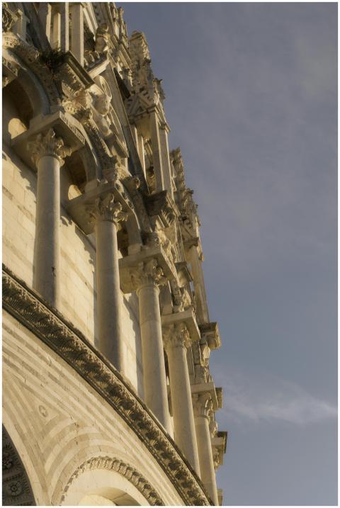 A detailed view of the Pisa Cathedral's ornate fac