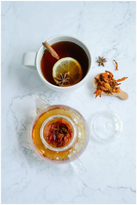 A cozy flat lay of herbal tea with cinnamon sticks