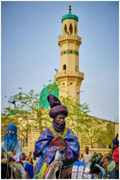 Vibrant traditional horse riders in colorful attir