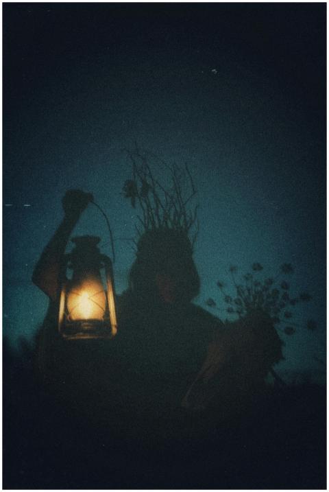 Mystical silhouette of a person holding illuminate