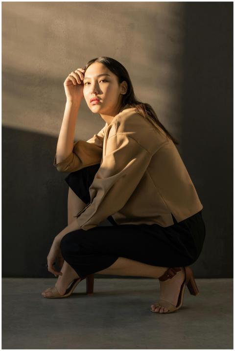 Caucasian woman in elegant pose, highlighted by so