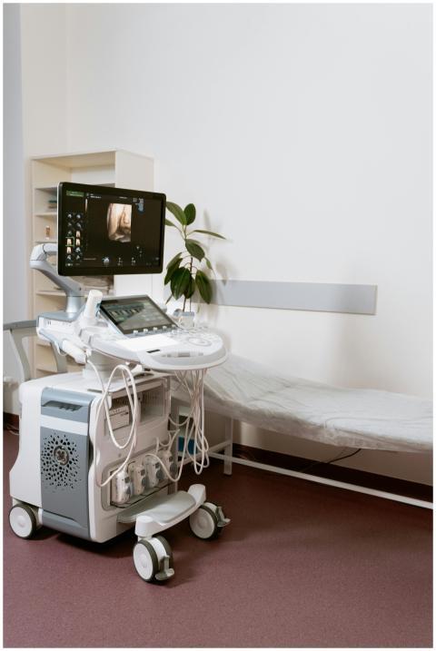 Ultrasound machine setup in a clinic room, ready f