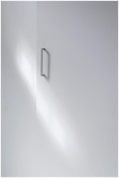 A minimalistic white cabinet door with a sleek han