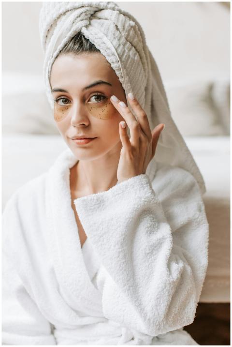 Portrait of a woman with a towel on her head apply