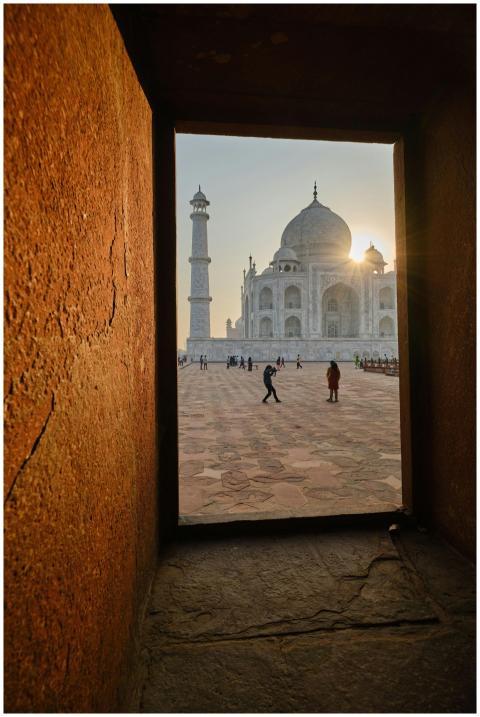 View of the Taj Mahal at sunrise from within an ar