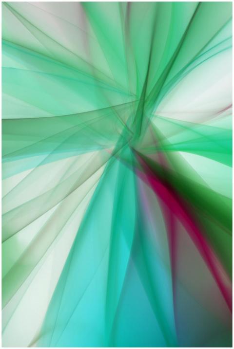 Vibrant abstract design with swirls of green and r