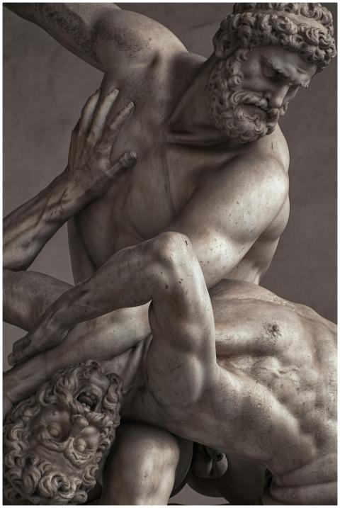 Intricate marble sculpture depicting a dramatic sc