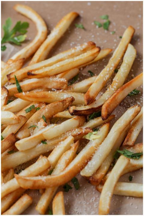 Delicious golden french fries seasoned with herbs