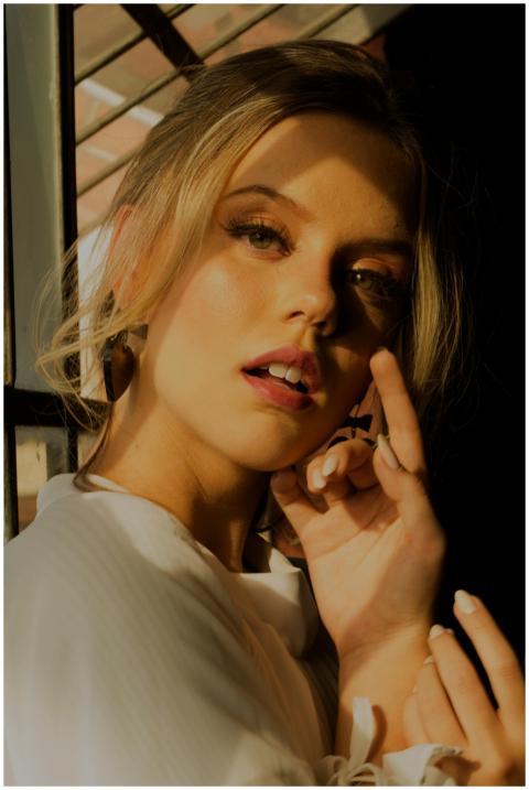 Striking portrait of a young woman with dramatic l