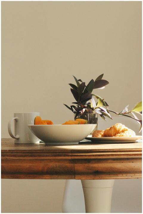 A warm inviting breakfast scene with coffee, crois