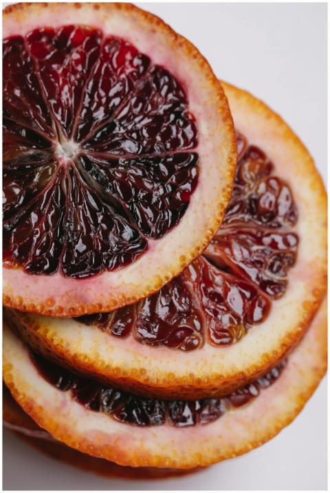 Closeup of cut in slices unpeeled fresh ripe juicy