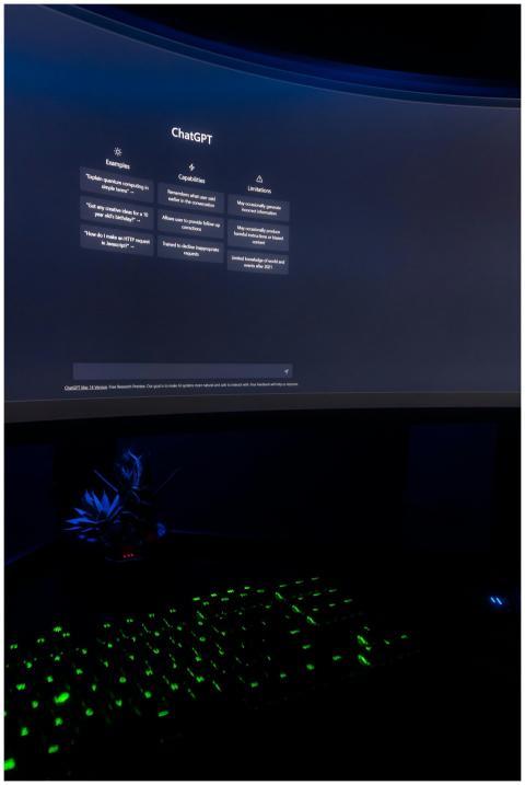 Dark ambient setup featuring ChatGPT interface on