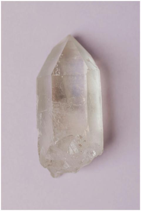 Minimalist photo of a natural clear quartz crystal