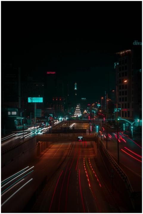 Dynamic cityscape at night with light trails in Ad