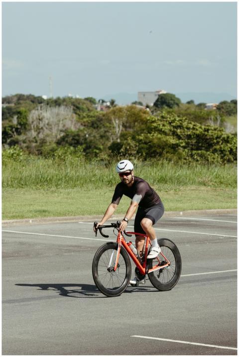 Adult male cyclist in helmet enjoying a ride on hi