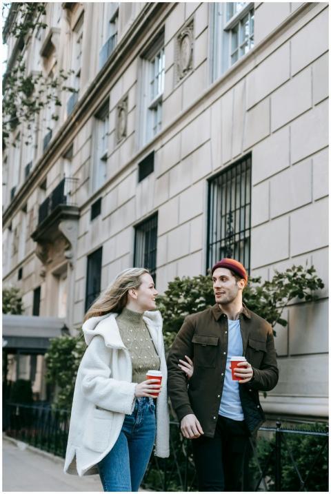 A couple enjoys a romantic walk in the city, sippi