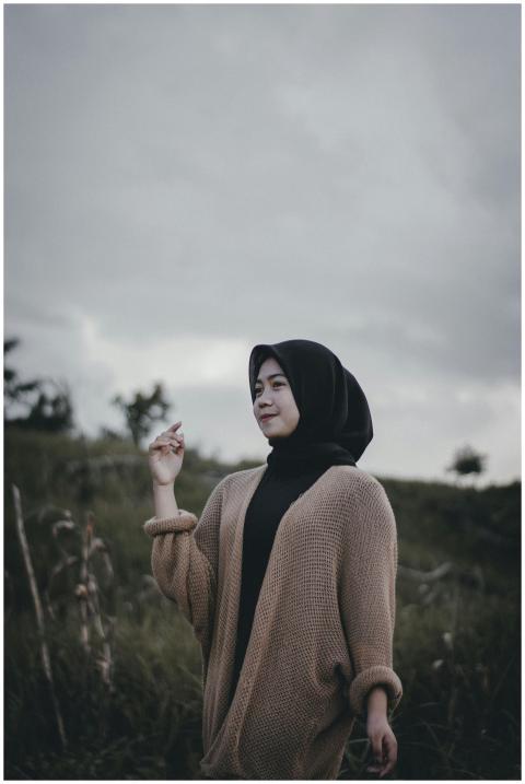 Elegant portrait of a woman in hijab, standing out