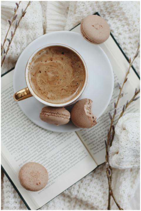 A comforting scene with coffee and macarons on an