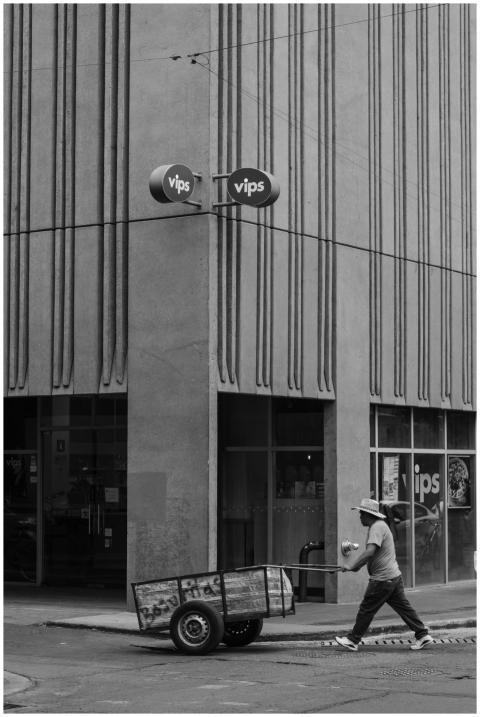 Man Walking Past Street