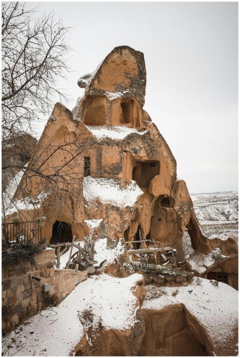 Winter scene of snow-covered rock-cut architecture