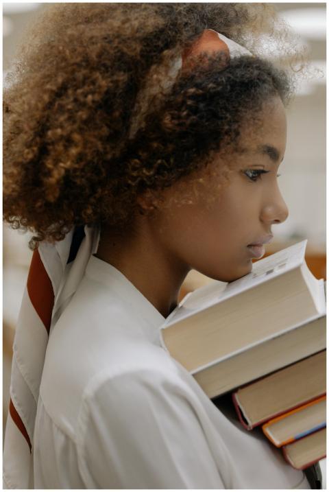 Side profile of a thoughtful young woman with afro