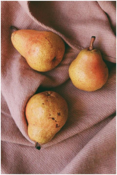 A cozy still life composition featuring ripe pears