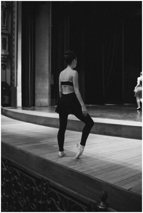 Black and white photo of a ballerina practicing on