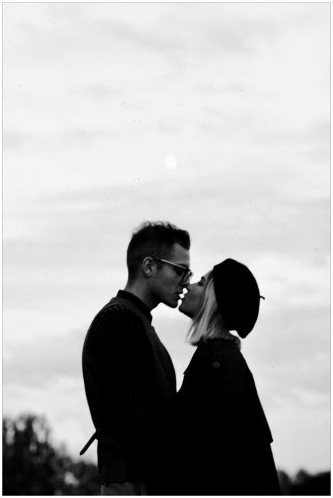 A romantic black and white silhouette of a couple