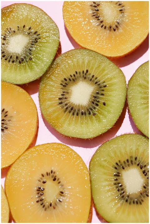 Top view of composed fresh tasty green kiwi slices