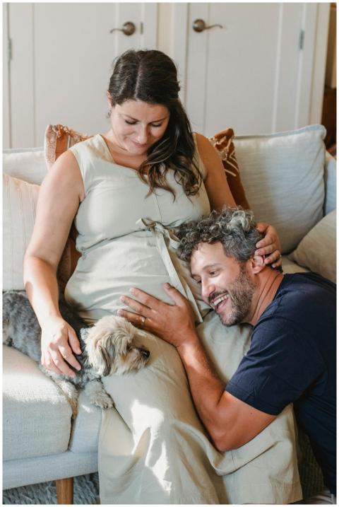 Pregnant couple enjoys bonding time with dog on co