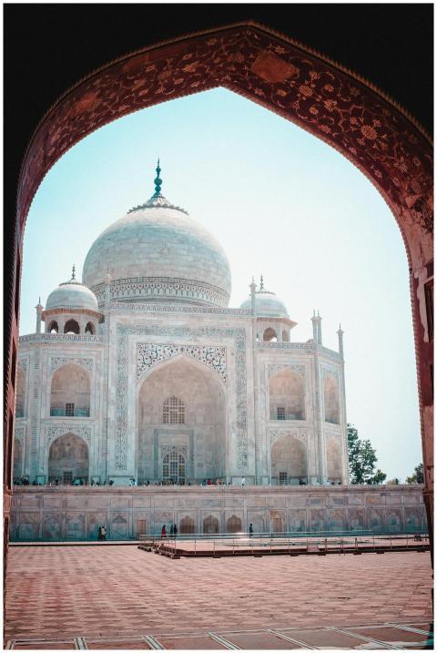 Majestic Taj Mahal viewed through an ornate archwa