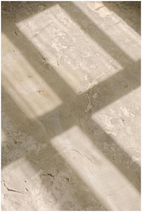 Abstract view of sunlight casting window shadows o