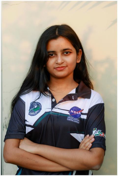 Dynamic portrait of a young female engineer in Dha