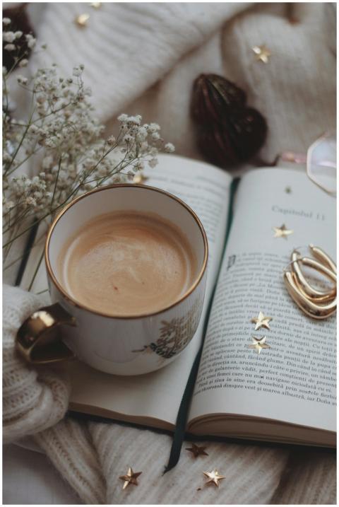 Warm still life with a book, coffee, and cozy deco